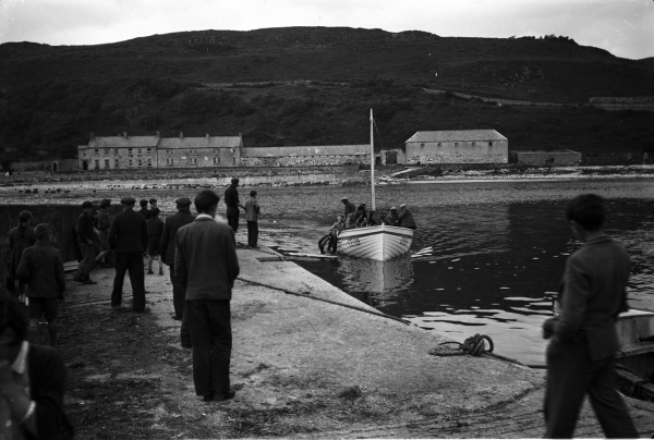 C022.24.00005 1955 Location Rathlin Island Photographer Michael J Murphy Relevant persons Jimmy McCurdy's boat arriving at pier Church Bay Rathlin from Ballycastle_0.jpg